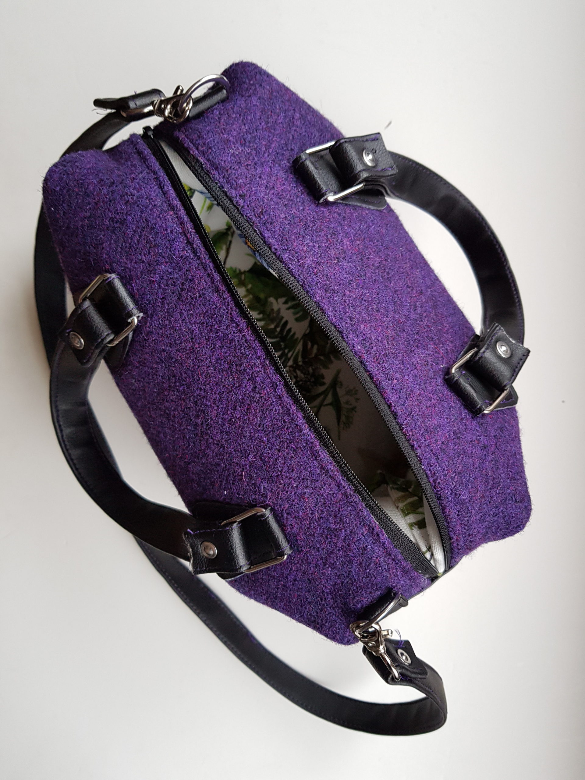 The purse as seen from above. The zipper is open so you can peek inside a little bit.