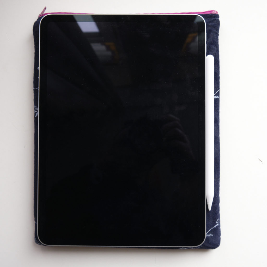 An iPad pro 11 inch lying on top of the new sleeve.