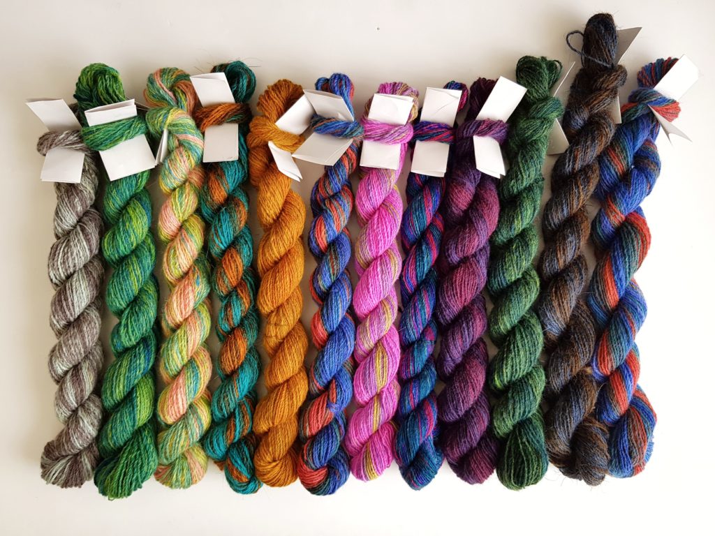 12 mini skeins of colourful yarn.