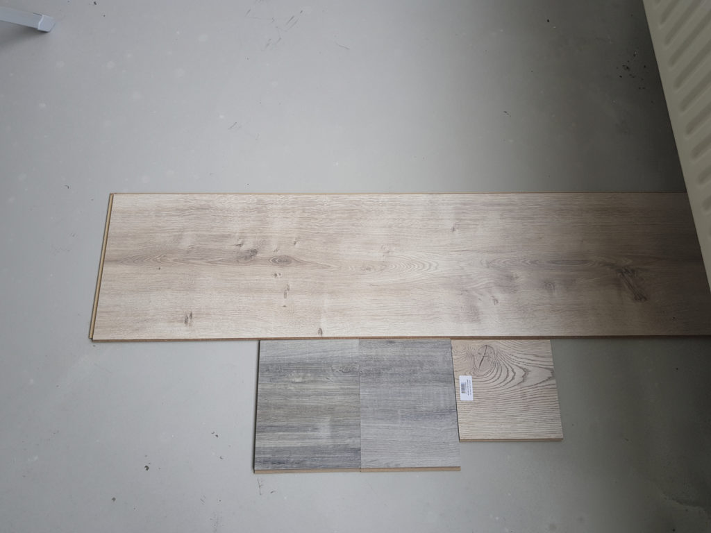 Some laminate flooring samples with different widths. We chose the widest one.