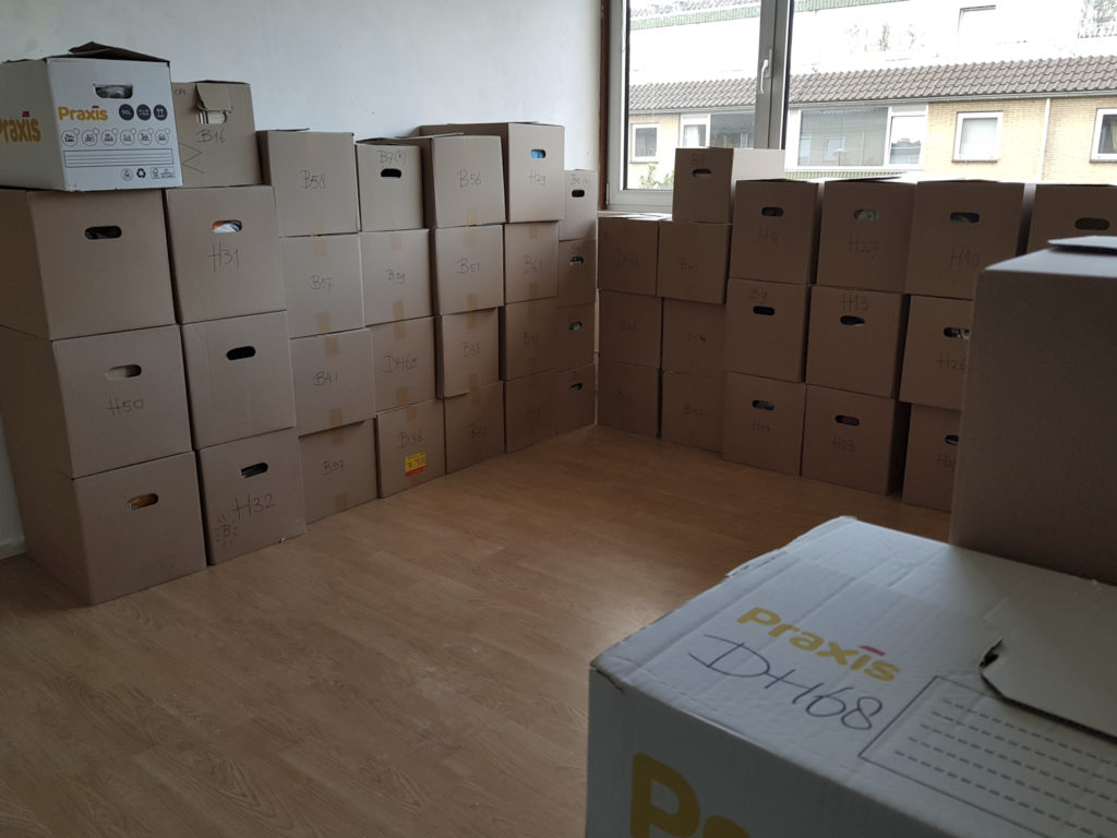 The study is filled with boxes.